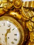An antique golden clock, close-up.